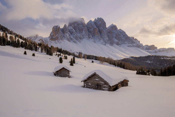 Italy The cabins of Gampenwiese with the Geisler mountain group in the background, Val di Funes   Villnoesser Tal, Bolzano   Bozen, South Tyrol, Italy, Europe, Photo by Emanuele Vidal