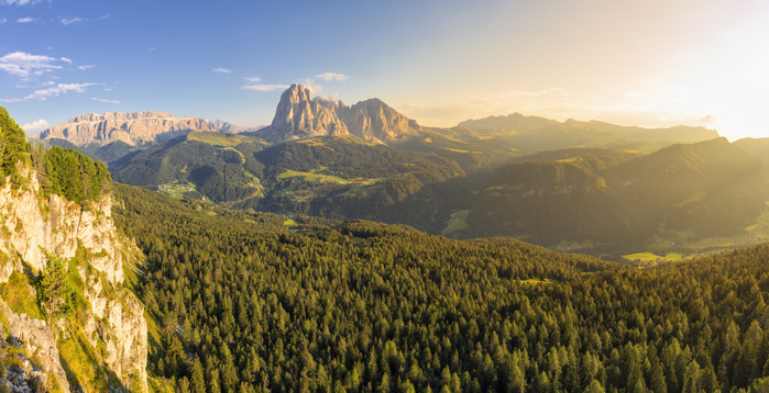 Italy Elevated view of the forest above Gardena Valley with view on Sassolungo Group. South Tyrol, Dolomites, Italy, Europe. Photo by Francesco Bergamaschi