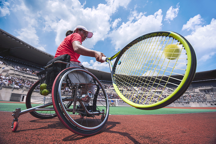 Wheelchair tennis players playing a match