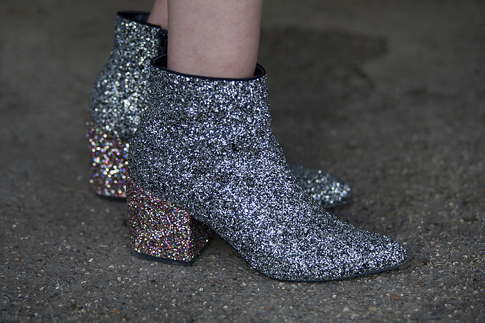 Spring Summer 2020 London Street Snapshot Street Style on day three of London Fashion Week SS 2020 on Saturday September 14th 2019, showcasing stylish individuals London is internationally known for. Image shows a pair of glitter finnished ankle boots
