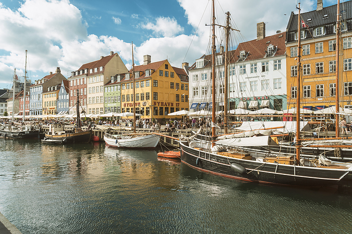 Nyhavn in Kopenhagen with old colorful andhousesboats anchored in summer Nyhavn with old colourful houses and boats anchored in summer, Copenhagen, Denmark, Europe, Photo by Armand Tamboly