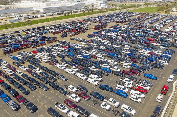 New vehicles awaiting delivery, Detroit, USA New vehicles awaiting delivery. Aerial view over new trucks and cars built by Fiat Chrysler Automobiles  FCA  awaiting transport to dealers. This yard is adjacent to FCA s Jefferson North Assembly Plant. Photographed at Cassens Transport s Connor Yard, Detroit, Michigan, USA.
