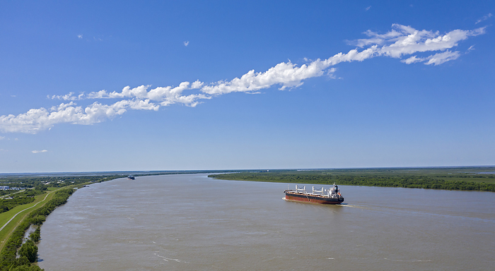 Ships on Mississippi River, USA Ships on Mississippi River. Panoramic view of the Greek bulk carrier Doric Victory travelling along the Mississippi River, USA. Photographed in Empire, Louisiana, USA.