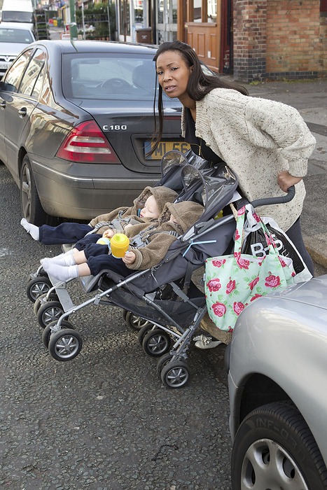 Mother with twins in buggy trying to cross road Mother with twins in buggy trying to cross road.  This photo has extra clearance covering Homelessness, Mental Health Issues, Bullying, Education and Exclusion, as well as clearance for Fostering   Adoption and general Social Services contexts .