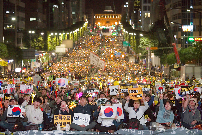 People attend a rally demanding prosecution reform near the Supreme Public Prosecutors  Office in Seoul Protest demanding prosecution reform, October 12, 2019 : South Koreans attend a rally demanding prosecution reform near the Supreme Public Prosecutors  Office in Seoul, South Korea. Tens of thousands of people held a peaceful street candlelight vigil to support Justice Minister Cho Kuk and to denounce Prosecutor General Yoon Seok Youl. Prosecutors have been investigating into allegations against Cho s family which were mostly raised by opposition parties and some news outlets. People at the rally vowed to defend Cho and President Moon Jae In, arguing that the influential prosecution is attempting to force minister Cho to quit in protest against prosecution reform. People accused the prosecution of abusing its authority and deliberately leaking information related to the ongoing probe to the media ahead of any trial. Moon s former aide Cho is an architect of the liberal government s prosecution reform scheme including creating an independent unit to investigate corruption by high ranking government officials and granting police more authority. Signs read, Defending Cho Kuk  and  Prosecution Reform .  Photo by Lee Jae Won AFLO   SOUTH KOREA 
