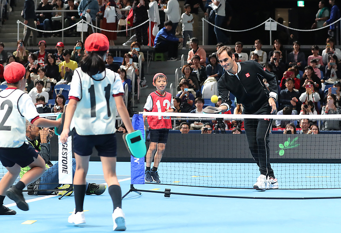 Uniqlo holds a charity tennis event Uniqlo LifeWear day Tokyo October 14, 2019, Tokyo, Japan   Swiss tennis player Roger Federer  R  enjoys tennis with a mitten as he joins a tennis clinic for children as Uniqlo holds a charity tennis event  Uniqlo Lifewear day Tokyo  in Tokyo on Monday, October 14, 2019.    Photo by Yoshio Tsunoda AFLO 