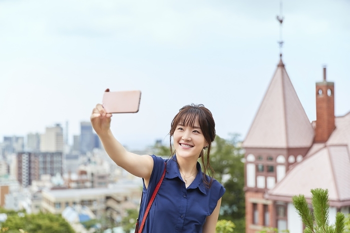 Japanese woman taking a photo