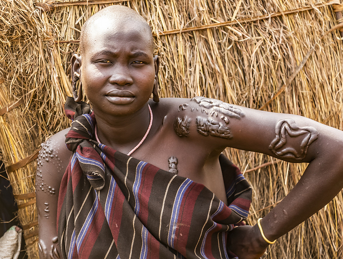 Mursi woman  in a village in Mago National Park, Omo Valley; Southern Nations Nationalities and Peoples' Region, Ethiopia, Photo by Peter Langer