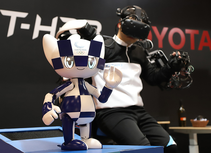 637 robot makers exhibit their latest ro bots at Asia s largest robot trade show December 18, 2019, Tokyo, Japan   Tokyo 2020 Olympics mascot Miraitowa robot, produced by Toyota Motor is synchronized with operator s motion by master slave control system at the International Robot Exhibition 2019 in Tokyo on Wednesday, December 18, 2019. 637 Japanese and foreign robot makers exhibit their latest robots at Asia s largest robot trade show.     Photo by Yoshio Tsunoda AFLO 