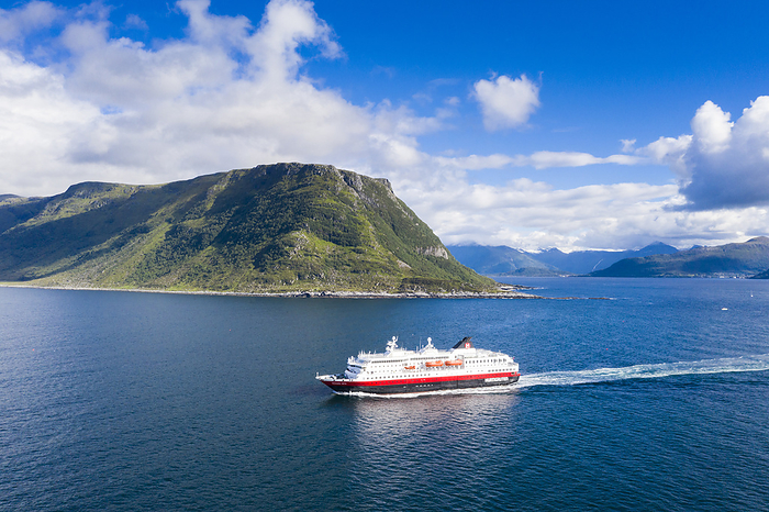 Aerial view of Hurtigruten during a daily trip along the fjord, Alesund, More og Romsdal county, Norway  drone  Aerial view by drone of Hurtigruten during a daily trip along the fjord, Alesund, More og Romsdal county, Norway, Scandinavia, Europe, Photo by Roberto Moiola