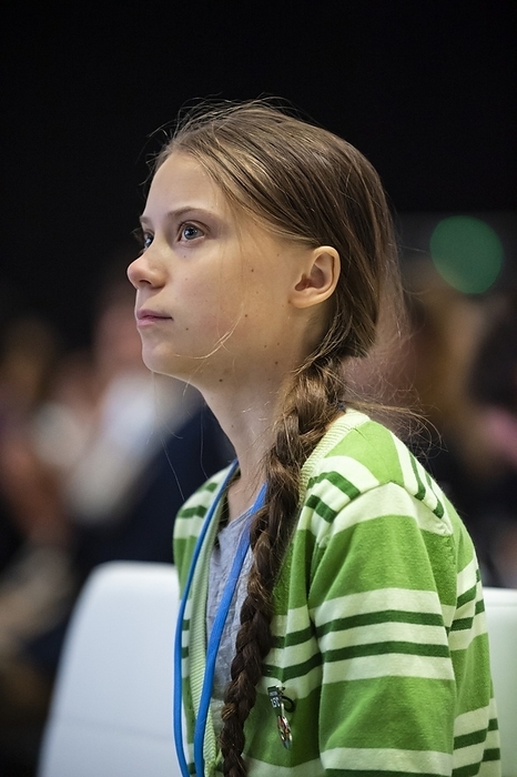 Greta Thunberg at COP25, Madrid, Spain, 2019 Editorial use only   Swedish climate activist Greta Thunberg  born 2003  attending the 2019 United Nations Climate Change Conference, known as COP25, at which she spoke. Thunberg rose to prominence at the age of 15 when she campaigned for action on global warming, with her protests leading to a worldwide movement of school strikes for action on climate change. She has continued to campaign on these issues and the needed lifestyle changes to avert a climate catastrophe. Photographed in Madrid, Spain, on 11th December 2019.