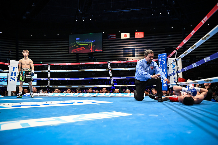WBO World Flyweight Title Match Kosei Tanaka of Japan  L  stands as referee calls the count over Wulan Tuolehazi of China in the 3rd round during the WBO flyweight title bout at Ota City  Photo by Hiroaki Yamaguchi AFLO  Tanaka takes the match deciding down in the third round