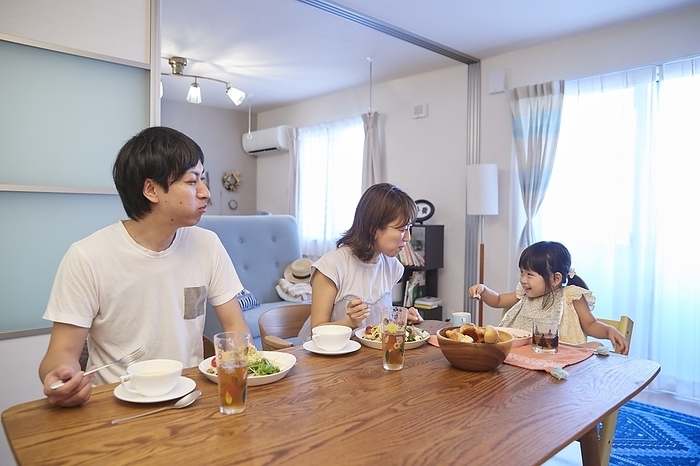 A Japanese family of three having a meal.