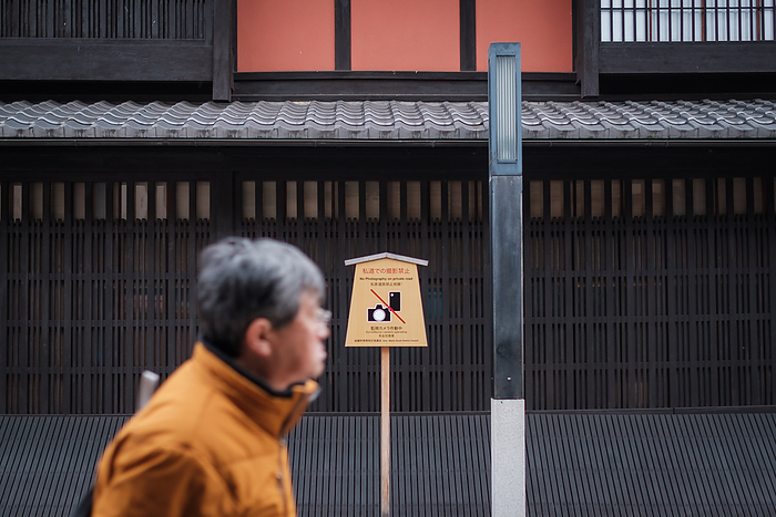Kyoto, Coronavirus hit tourism business A man passes by a board sign banning photography on Hanamikoji Street on February 10, 2020. The boorish behavior of tourists who have harassed geisha, destroyed property and committed other obnoxious acts has led to a ban on photography on private roads in Kyoto s famed Gion district.Following the outbreak of Coronavirus situation many chinese tourists cancelled trip in Japan during winter. The city is empty of bus and tourist s groups. February 10, 2020  Photo by Nicolas Datiche AFLO   JAPAN 
