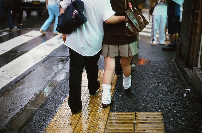 Shibuya Couple of high school girls and boys in loose socks at Shibuya