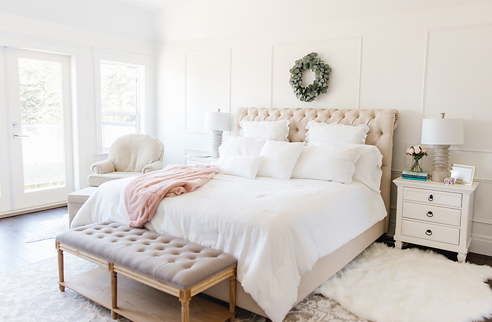 white bedroom tufted bed