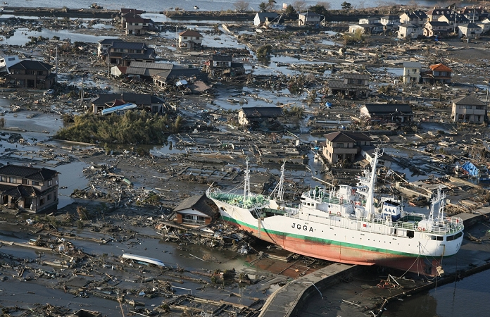 Giant East Japan Earthquake Devastating tsunami  A residential area severely damaged by the tsunami. A boat washed up on the shore illustrates the magnitude of the tsunami. March 12, 2011, 4:19 p.m., Higashimatsushima City, Miyagi Prefecture