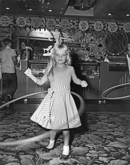 United States:  1958.
The hula hoop craze sweeps the country. Over 100 million were sold in the United States in the first year. This contest was held in a movie theater lobby, back when popcorn cost a dime and only came in one size.