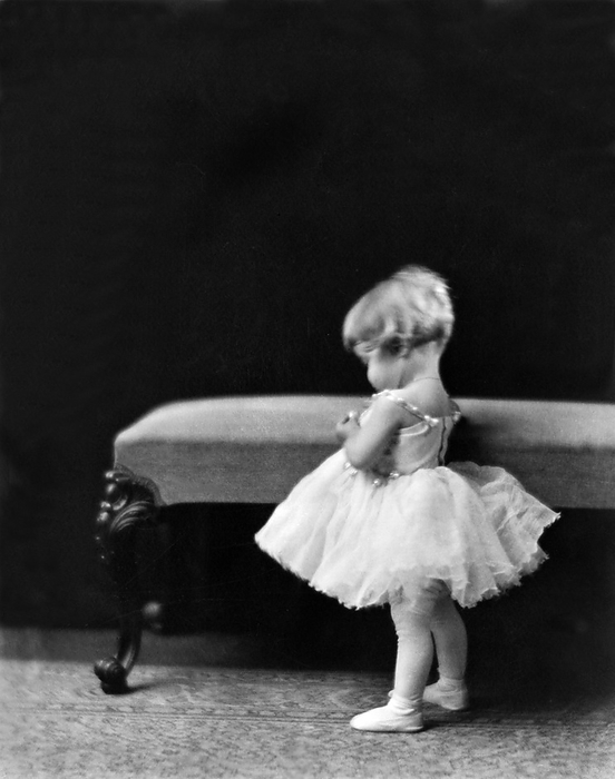 Hollywood, California:  1918
Dancer and choreographer Marge Champion wearing ballet slippers and dress at the age of one year old.