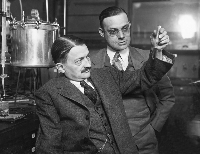 Danville, Illinois:  March 8, 1928
Two scientists looking at a test tube containing cornstalk pulp that they hope can be used to replace cellulose in manufacturing other products.