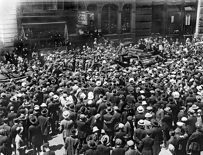 New York, New York:  May 16, 1918
A tally-ho full of showgirls invades the Financial District in New York to sell tickets to the Red Cross Ball in front of the Brokers' Cafe on Wall Street.