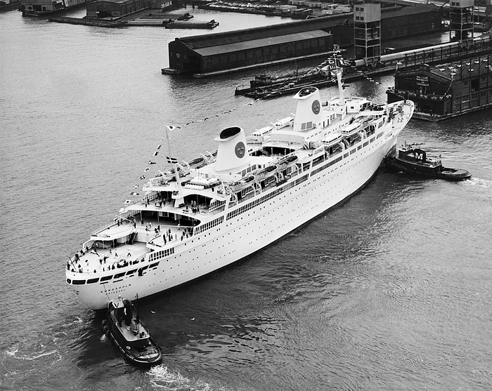 New York, New York:   May 2, 1966
The MS Kungsholm gets help into her slip from a couple of  tugboats after making her maiden voyage across the Atlantic Ocean. It is the flagship of the Swedish American Line.