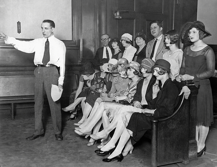 Chicago, Illinois: July 22, 1926.
Photo shows a bench full of complainants listening to Assistant State's Attorney Robert M. Woodward make his charges to the Admiration Products Co. which is claimed to have run a beauty contest to lure young girls into white slavery.