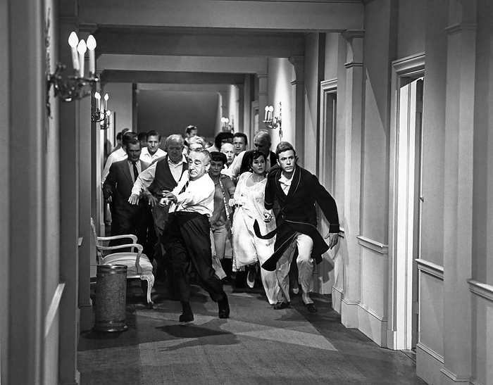 Hollywood, California: c. 1944
A mob of frightened people running down a hotel corridor.