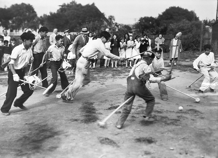 Santa Barbara, California: c. 1927
Children playing broomstick polo at the Eastside Social Center. to Underwood Archives / The Image Works