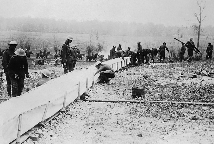Europe:  Ocotober 9, 1918
British Tommies erecting a canvas watering trough for the use of the cavalry. Water services to the front were critical, and the water provided had to be chemically treated and filtered the same as a municipal waterworks.