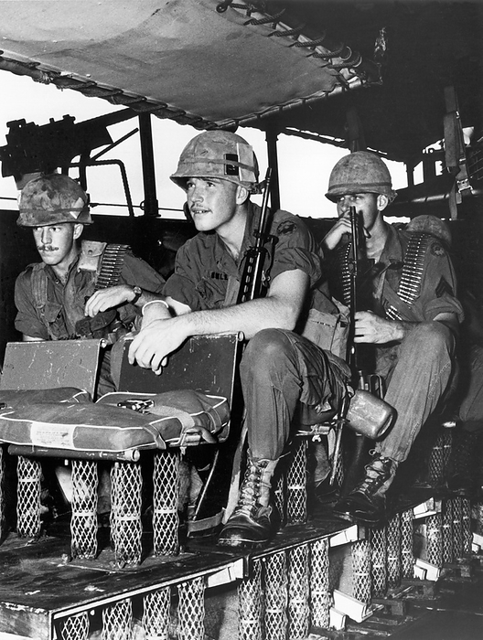Vietnam:   April 5, 1968
Soldiers riding in a U.S. Navy Armored Troop Carrier equipped with shipboard shock protection chairs and deck platforms equipped with the outer jacket of the new General Motors energy absorbing steering column to help protect against underwater exposions from mines in the Vietnam waterways.