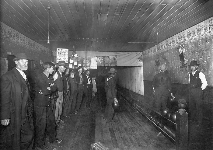 United States:  c. 1890
Men bowling in a two lane bowling alley.
