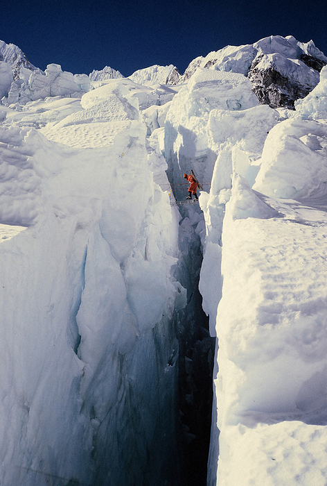 Members of the Japanese Alpine Club Everest Climbing Team passing through a huge crevasse in the ice fall  March 1970  The Japan Alpine Club s Everest Climbing Team passing through a huge crevasse at the Icefall in Nepal in 1970. March, 1970, photo by Katsuhisa Kimura