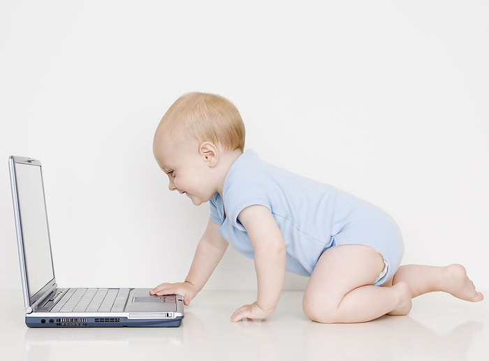 Baby looking at laptop