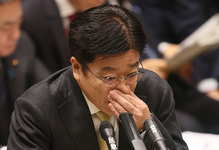 Japanese Prime Minister Shinzo Abe attends Upper House s budget committee session March 23, 2020, Tokyo, Japan   Japanese Health Minister Katsunobu Kato pinches his nose as he answers a question by an opposition lawmaker at Upper House s budget committee session at the National Diet in Tokyo on Monday, March 23, 2020. Abe hinted at the possibility of Tokyo 2020 Olympic Games postponement.      Photo by Yoshio Tsunoda AFLO 