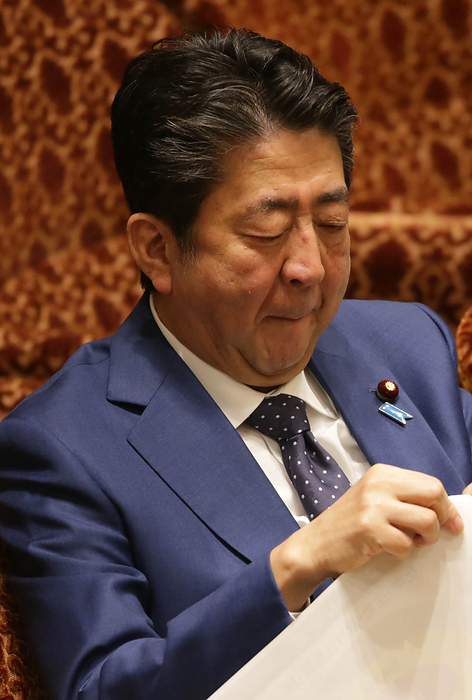 Budget Committee of the House of Councillors Budget Committee of the House of Councillors Prime Minister Shinzo Abe holding back a yawn.