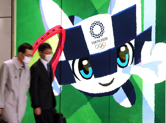 Japan s share prices rebounded over 19,000 yen level March 25, 2020, Tokyo, Japan   Pedestrians pass before a large illustration of Tokyo 2020 Olympic Games mascot Miraitowa in Tokyo on Wednesday, March 25, 2020. Japanese government and International Olympic Committee  IOC  agreed to postpone Tokyo 2020 Olympic Games on March 24 for a year due to the global outbreak of the new coronavirus.    Photo by Yoshio Tsunoda AFLO 