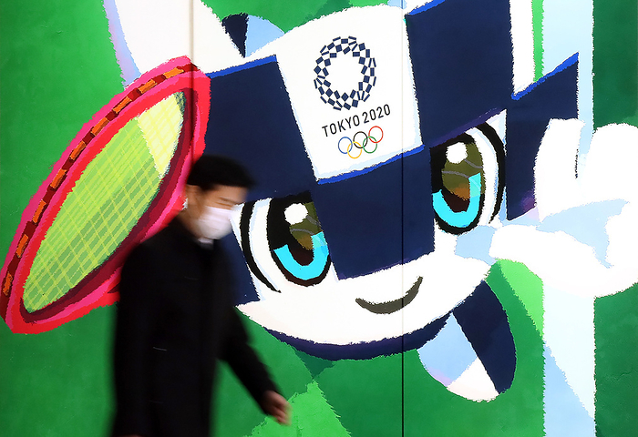 Japan s share prices rebounded over 19,000 yen level March 25, 2020, Tokyo, Japan   A pedestrian passes before a large illustration of Tokyo 2020 Olympic Games mascot Miraitowa in Tokyo on Wednesday, March 25, 2020. Japanese government and International Olympic Committee  IOC  agreed to postpone Tokyo 2020 Olympic Games on March 24 for a year due to the global outbreak of the new coronavirus.    Photo by Yoshio Tsunoda AFLO 
