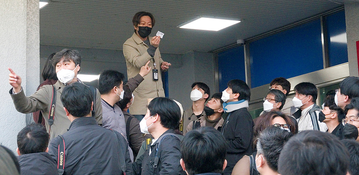 Korean photographers select a few photographers to do the media pool coverage for Cho Ju Bin, head of an online sexual blackmail ring to avoid possible COVID 19 infections at a  police station in Seoul General view, Mar 25, 2020 : South Korean photographers select a few photographers to do the media pool coverage for Cho Ju Bin  not in photo , head of an online sexual blackmail ring called  Nth room  before Cho leaves Jongno police station to be transferred to the prosecution for further investigation in Seoul, South Korea. The local photographers made a decision for the pool coverage to avoid possible COVID 19 infections as dozens of photographers gathered to cover the news in a confined place. According to local media, Cho is suspected of blackmailing dozens of victims into performing violent sex acts and selling the videos in mobile chat rooms on messaging services, such as Telegram and Discord. About 74 people, including 16 underage girls, are known to have been exploited in the case. About 260,000 people are known to have joined the mobile chat rooms.  Photo by Lee Jae Won AFLO   SOUTH KOREA 