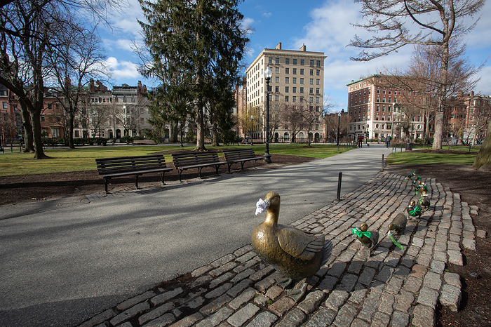 Stay at Home Advisory in Massachusetts during Covid 19 Pandemic  March 24, 2020, Boston Public Garden, Boston, Massachusetts, USA: Statue of Make Way for Ducklings wearing face masks and green attires, nodding to St. Patcick day during Coronavirus Pandemic.  Massachusetts Governor Charlie Baker issued Stay at Home advisory effective Tuesday afternoon March 24, due to Coronavirus pandemic.  Photo by Keiko Hiromi AFLO 