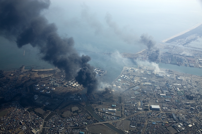 Great East Japan Earthquake Devastated by the Great Tsunami March 13, 2011, Sendai, Japan   Columns of thick black smoke reach high in the air from a burning oil refinery in Sendai, Miyagi prefecture, on Sunday, March 13, 2011, two days after a powerful earthquake with a magnitude 9.0 jolted Japan s northeastern prefectures, wreaking havoc on otherwise The death toll from the nation s worst and the world s fourth worst quake could rise above 10,000.  Photo by Tohan Koku Service AFLO   0994   mis 