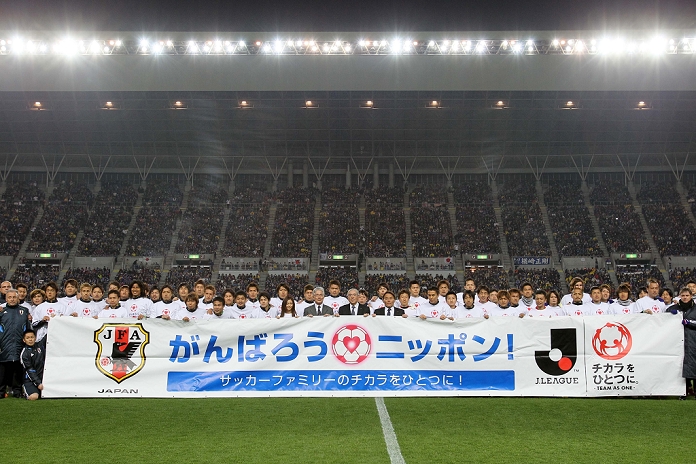 Reconstruction Assistance Charity Match Two team group, MARCH 29, 2011   Football :  Gambaro, Japan  charity match between Japan and J.League select team  TEAM AS ONE  at Nagai Stadium in Osaka, Japan. Japan s national team took on a J League select team in a charity match to benefit victims of the 2011 Tohoku earthquake and tsunami held at the Nagai Stadium in Osaka on Tuesday. The game was hastily arranged after New Zealand pulled out of a friendly fixture due to fears over radiation levels and all 38,000 match tickets were sold within an hour of going on sale. The J League season was postponed after just one game after the earthquake and is now set to restart on April 23rd although four stadium are still unusable and awaiting repair.   Photo by AFLO SPORT   1080 