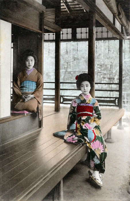 160301 0048   Engawa Two women in kimono and traditional hairstyles at a traditional Japanese house.   The women are sitting on the engawa      , a veranda like extension of the house.  This postcard was published sometime between March 1907  Meiji 40  and March 1918  Taisho 7 .  Photo by MeijiShowa AFLO