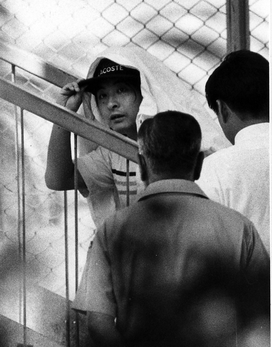 Serial Kidnapping and Murder of Young Girls  Konno Mari Case: Suspect Tsutomu Miyazaki, Kasuga machi, Iruma City, Japan, attends the kidnapping site inspection. Between 1988 and 1989, four young girls were lured and murdered one after another in Tokyo and Saitama  on July 23, 1989, Tsutomu Miyazaki, 26, a printing industry assistant in Itsukaichi, Tokyo, was arrested for kidnapping and indecent assault. Verification of Iruma Village, where the kidnapping took place.