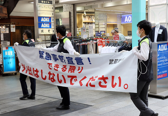Musashino city officers hold a banner to demand to refrain from going out May 3, 2020, Tokyo, Japan   Musashino city officers hold a banner to demand to refrain from going out at a shopping arcade in Tokyo on Sunday, May 3, 2020. Prime Minister Shinzo Abe is expecting to extend a state of emergency until end of this month.    Photo by Yoshio Tsunoda AFLO 