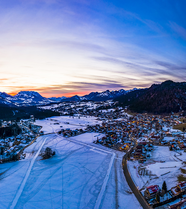 Reit im Winkl Germany Germany, Bavaria, Reit im Winkl, Helicopter view of snow covered mountain village at dawn