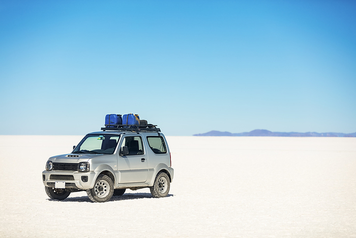 Bolivia Vehicle in the middle of the Salar de Uyuni  Potosi, Bolivia, Photo by O Neil Castro   Design Pics