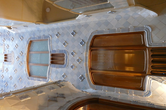 glazed geometric tiles inside the Casa Batllo, Barcelona, Spain  designed by Antoni Gaudi, glazed geometric tiles inside the Casa Batllo, a building in the center of Barcelona, designed by Antoni Gaudi, It is considered one of his masterpieces. A remodel of a previously built house, it was redesigned in 1904 by Gaudi and has been refurbished several times after that. Gaudi s assistants Domenec Sugranes i Gras, Josep Canaleta and Joan Rubio also contributed to the renovation project. The local name for the building is Casa dels ossos  House of Bones , as it has a visceral, skeletal organic quality.