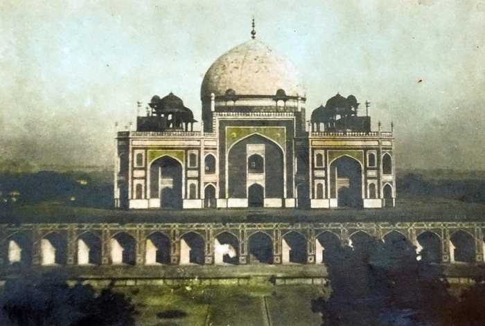 Humayun s tomb in Delhi, India 1930 Humayun s tomb  Maqbaera e Humayun  is the tomb of the Mughal Emperor Humayun in Delhi, India. The tomb was commissioned by Humayun s first wife and chief consort, Empress Bega Begum in 1569 70, and designed by Mirak Mirza Ghiyas and his son, Sayyid Muhammad. It was the first garden tomb on the Indian subcontinent, and is located in Nizamuddin East, Delhi, India.