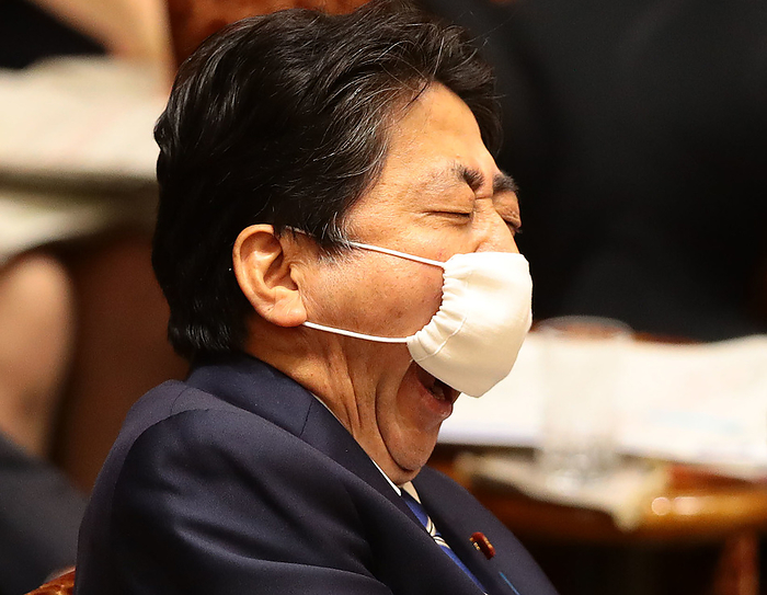 Budget Committee of the House of Councillors Prime Minister Shinzo Abe yawns so hard he can t hide it with his Abeno mask during a Upper House Budget Committee meeting, June 11, 2020, in the Diet.